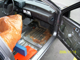 Close up - Passenger Side View - Carpet Removed and Rolled up - Stuffed in Two Large Leaf Bags. Body Work Required: Rust Repair, Passengers Side Floor Pan